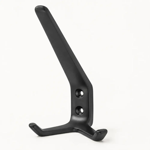 Black STAALFABRIQ coat rack with three hooks mounted on a wall for hanging jackets and accessories.