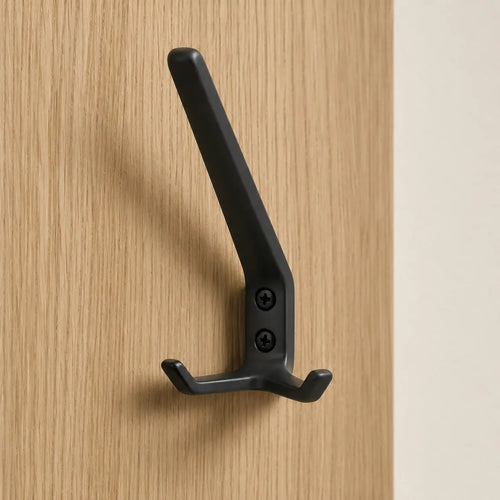 Black coat rack with three hooks from STAALFABRIQ, featuring a sleek mat finish and modern design.