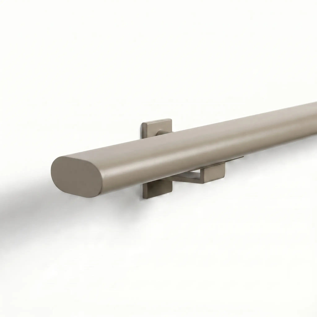 Ovaal-shaped greige stainless steel stair railing trapleuning with seamless finish, measuring 48x20mm, by STAALFABRIQ.