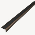Bronze trapnose profile by STAALFABRIQ, showcasing a detailed close-up of the sturdy, curved metal construction.