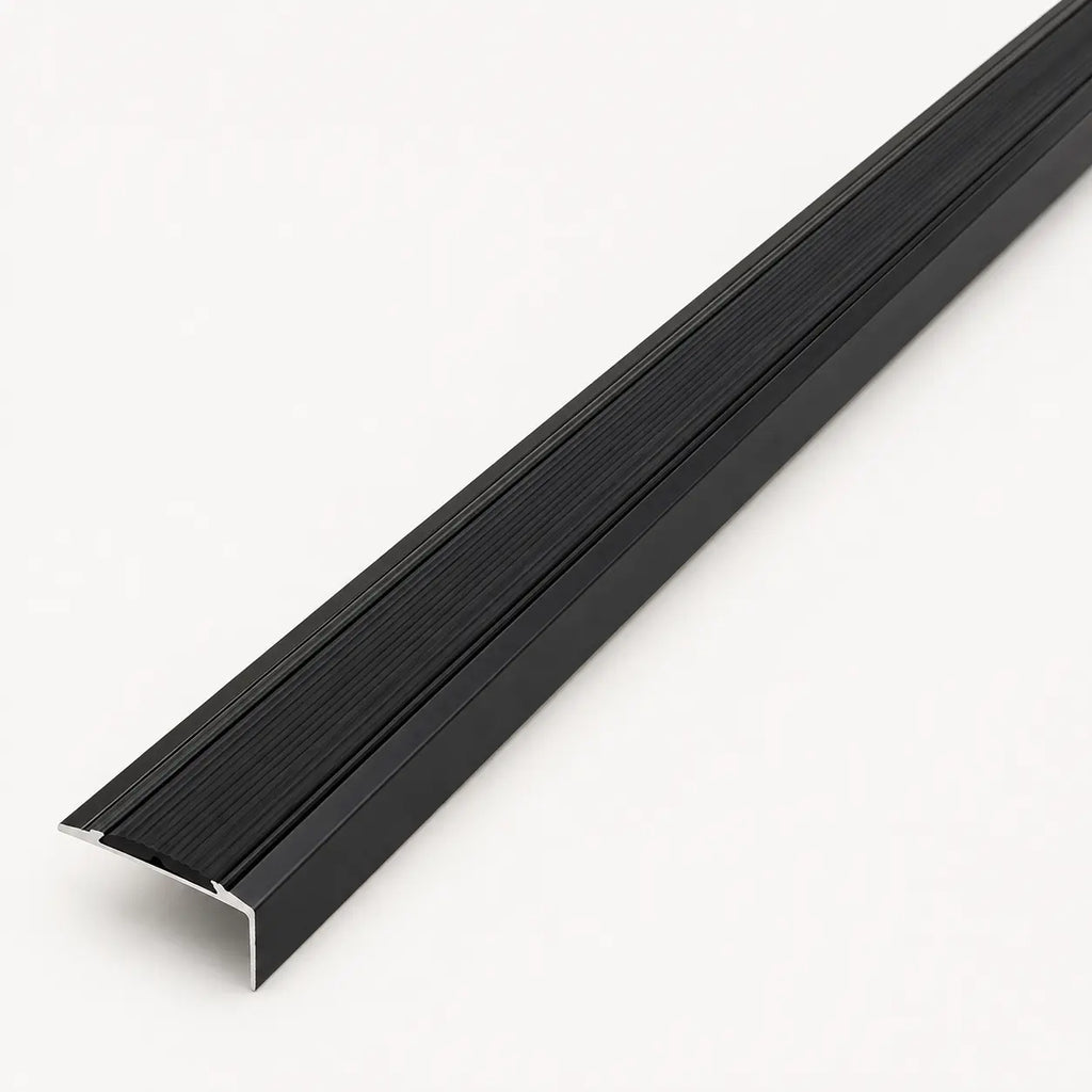 Black stair nosing profile from STAALFABRIQ, showing the textured rubber surface designed for stair edge safety.