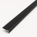 Black stair nosing profile from STAALFABRIQ, showing the textured rubber surface designed for stair edge safety.