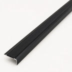 Black stair nosing profile from STAALFABRIQ, showing the textured rubber surface designed for stair edge safety.